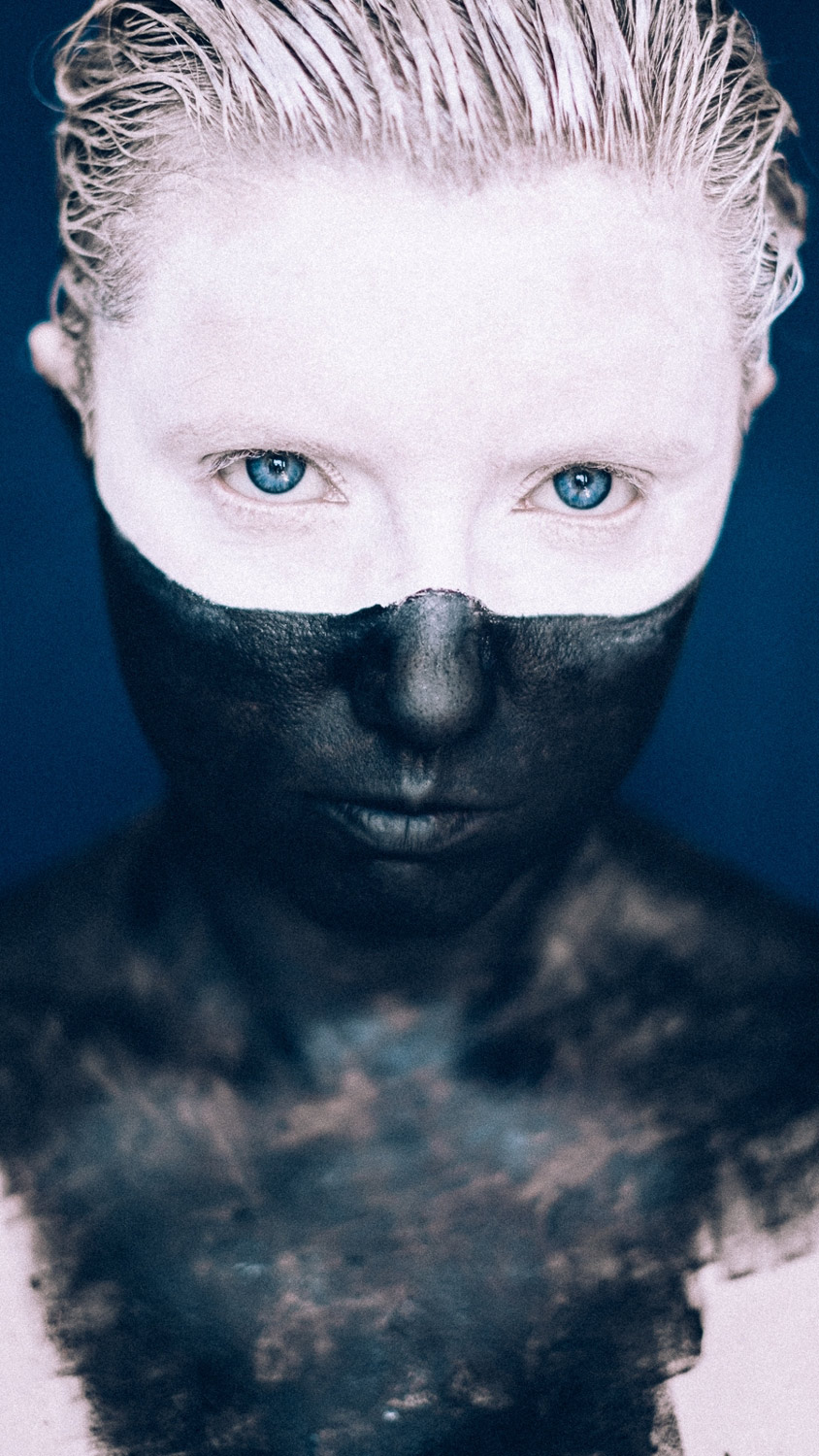 Self Portrait with Face Paint and Blue Background
